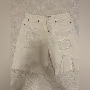 Free People white denim ripped jean shorts with button fly